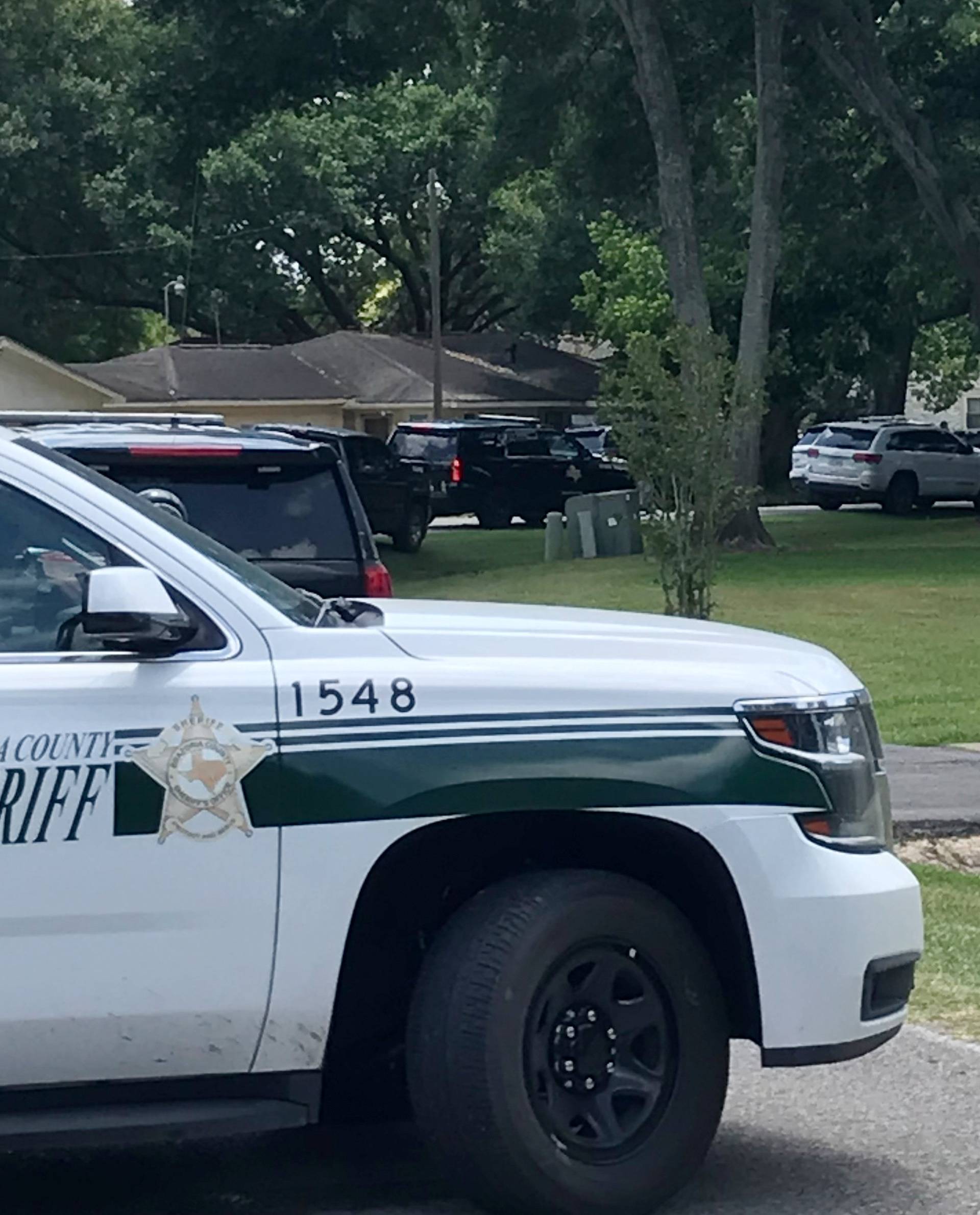 Police vehicles line the blocked-off street where the home of Dimitrios Pagourtzis, the suspect in the Santa Fe High School shooting, is located in Alvin, Texas