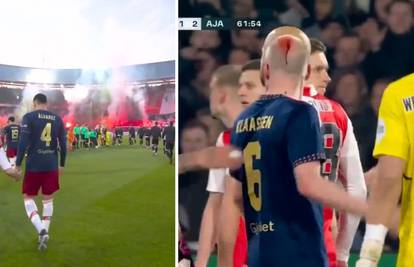 VIDEO Igrača Ajaxa pogodili u glavu, sudac prekinuo derbi