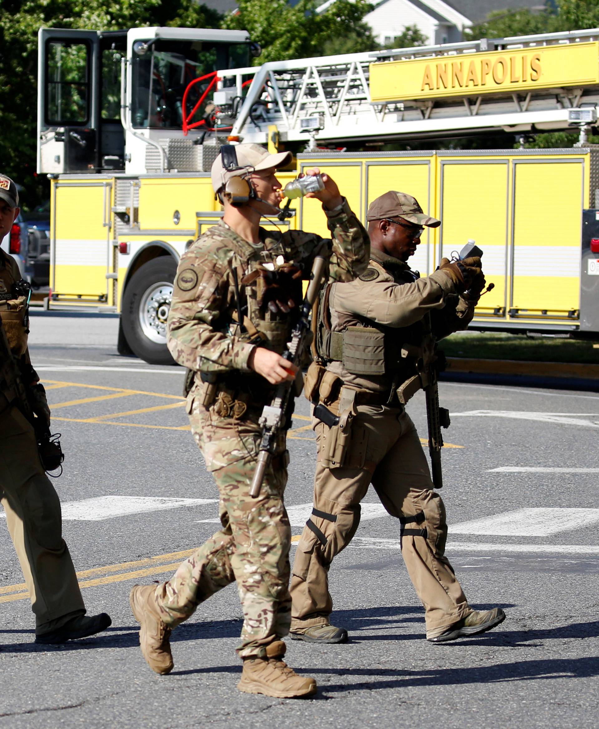 Police gather at shooting scene outside Capital Gazette newspaper in Annapolis, Maryland