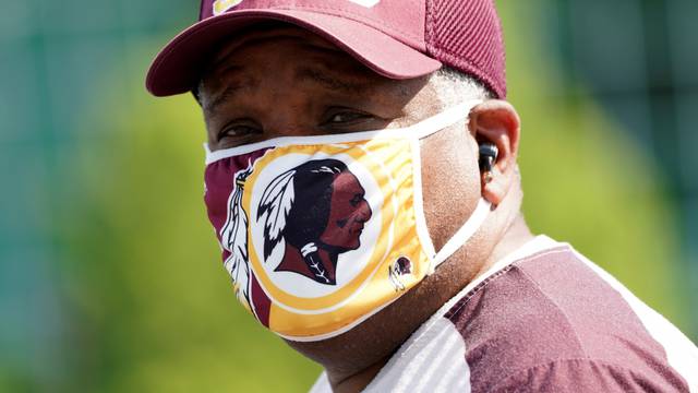 Man wears Washington Redskins-themed face mask at FedEx Field in Landover, Maryland