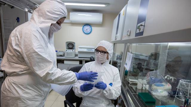 Experts from bio organic department of Polish Science Academy work on blood samples of coronavirus disease (COVID-19) in a laboratory in Poznan, Poland