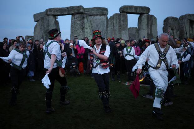 Winter solstice celebrations during sunrise at Stonehenge