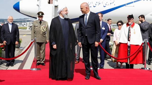 Swiss Federal President Alain Berset, welcomes Iranian President Hassan Rohani during his visit to Switzerland at the Zurich airport in Kloten