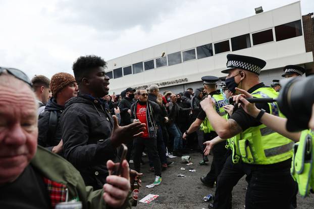 Manchester United fans protest against their owners before the Manchester United v Liverpool Premier League match