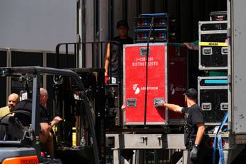 Workers unload items from trucks at Madison Square Garden, in New York City