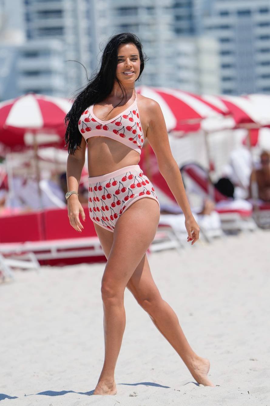 Ivana Knoll wears a cherry outfit to the beach in Miami
