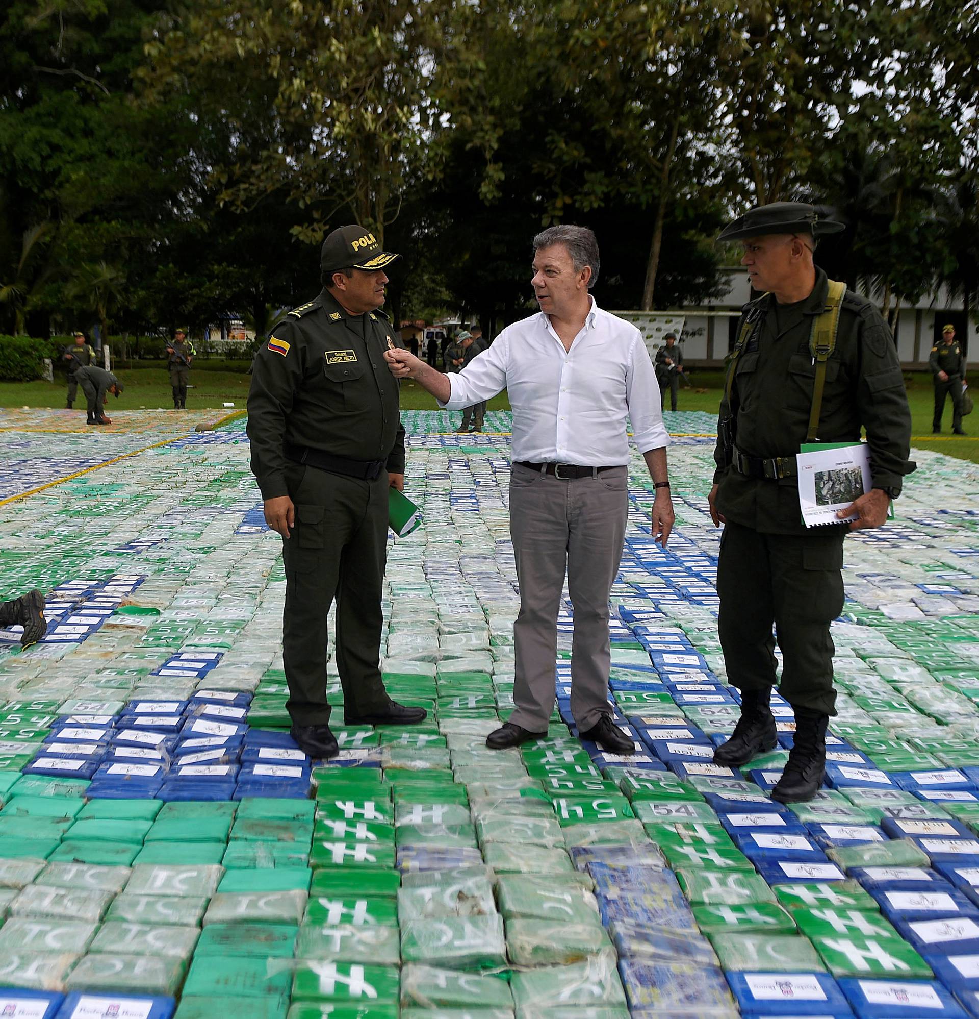 Colombia's President Juan Manuel Santos looks on after the seizure of more than 12 tons of cocaine in Apartado, Colombia