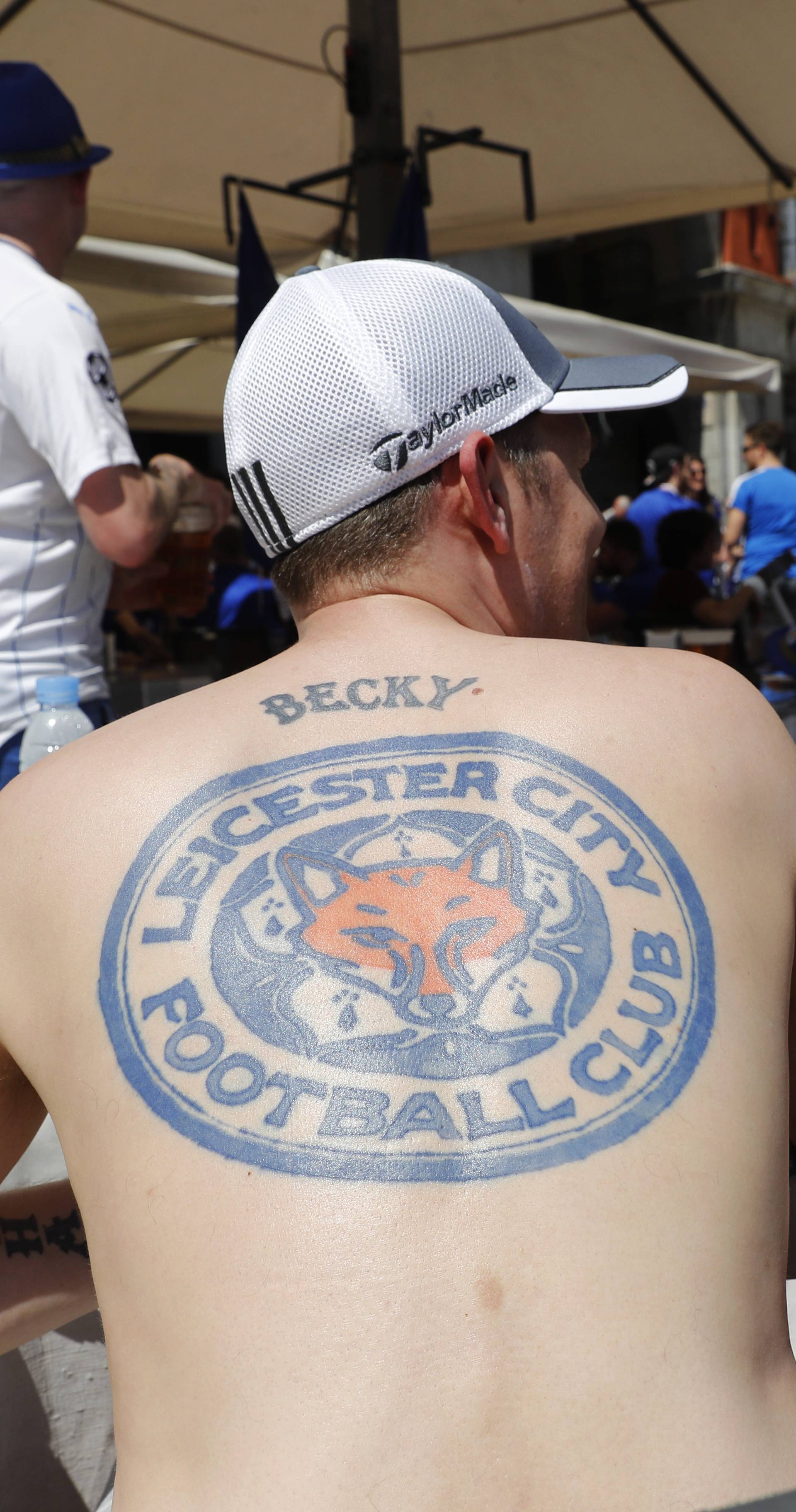 A Leicester fan display a tattoo in the Plaza Mayor before the match