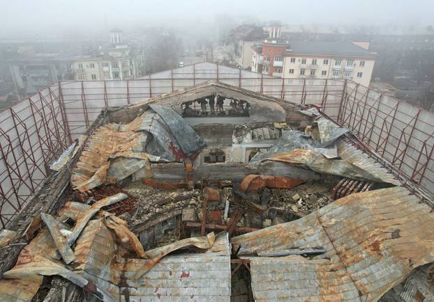 FILE PHOTO: A view shows a fenced theatre building destroyed in the course of Russia-Ukraine conflict in Mariupol