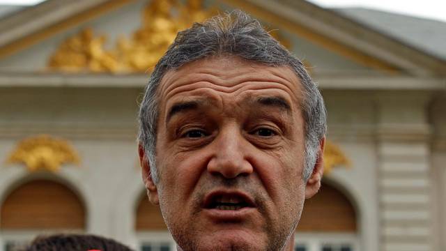 FILE PHOTO: Romanian lawmaker and soccer club owner George Becali  talks to the media in Bucharest
