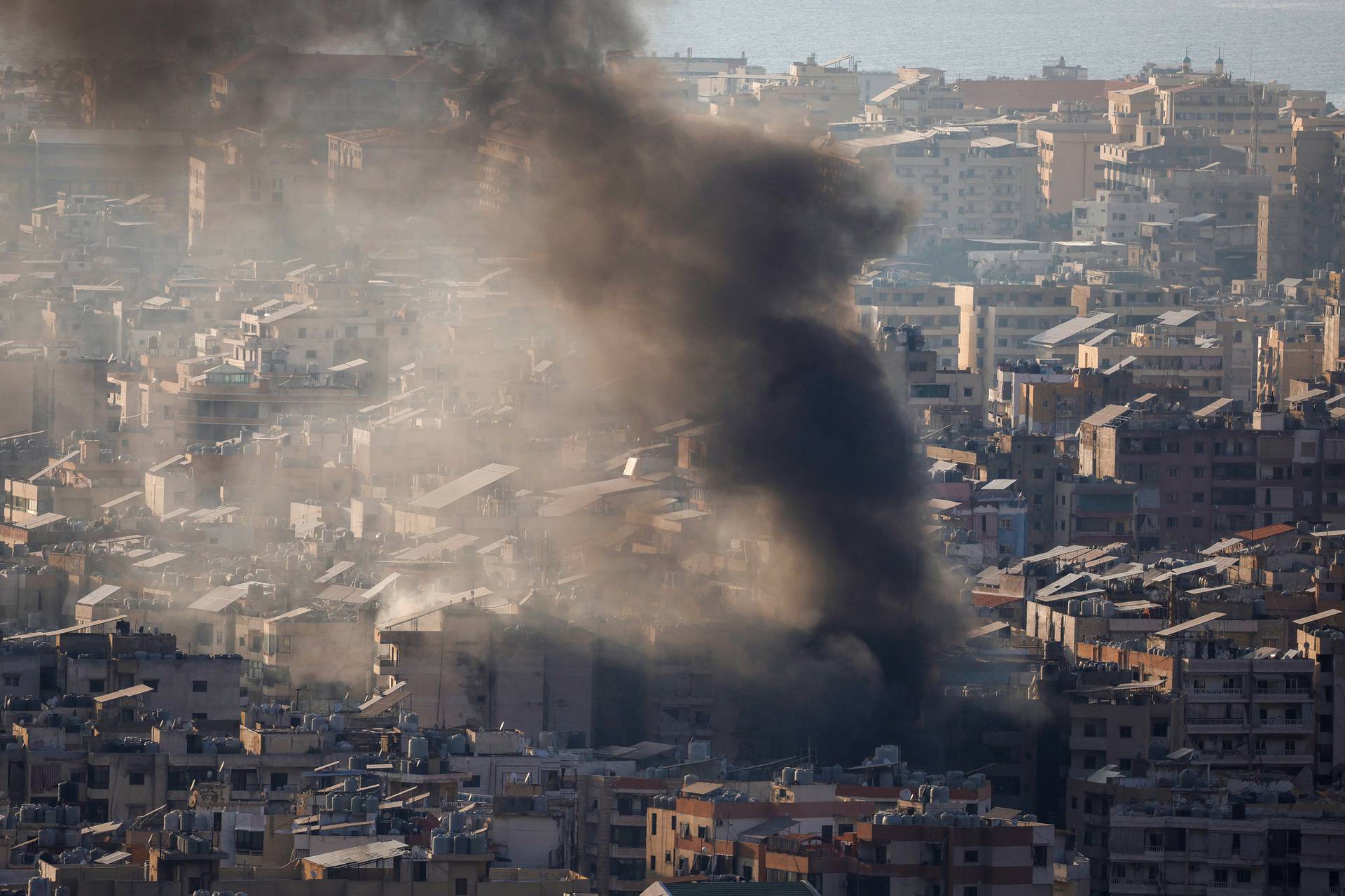 Smoke rises over Beirut’s suburbs, amid ongoing hostilities between Hezbollah and Israeli forces