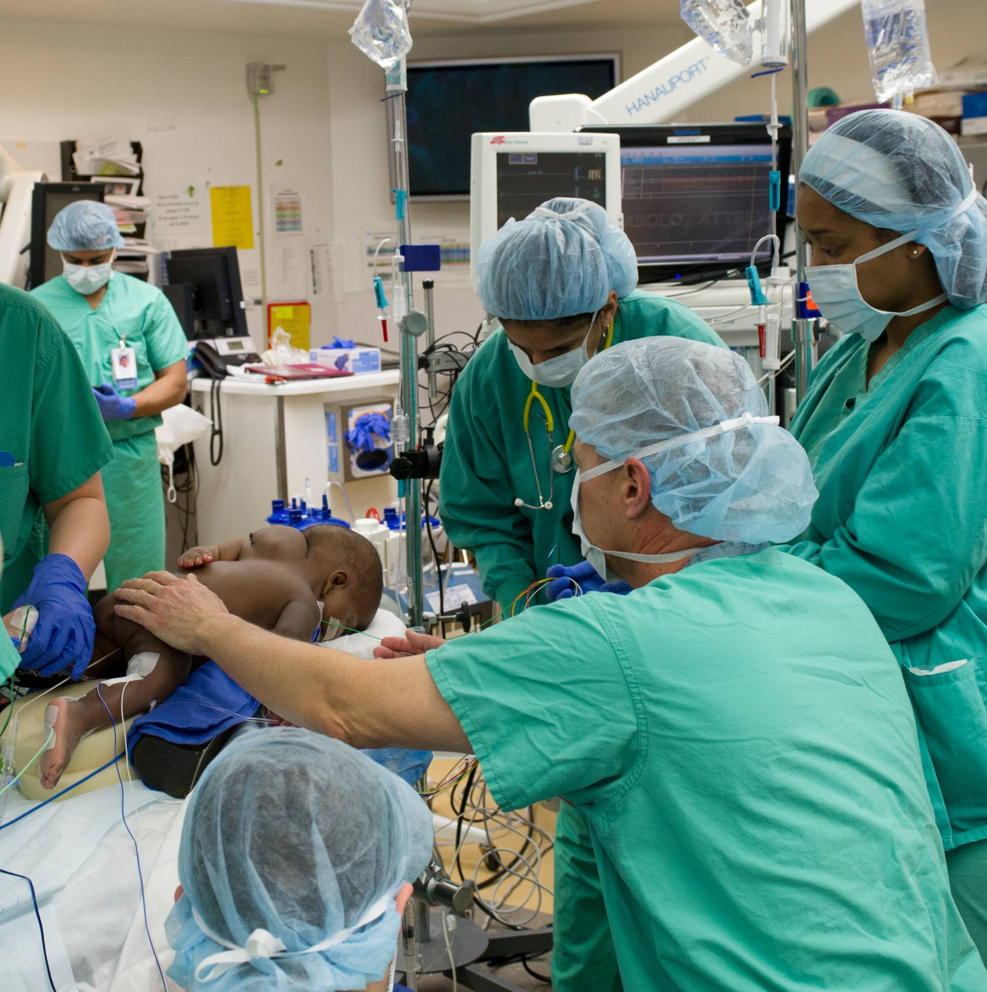 Hospital staff prepare 10-month old "Baby Dominique" for surgery to treat the infant born with four legs and two spines at Advocate Children's Hospital in Park Ridge, Illinois