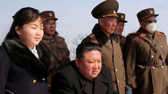 FILE PHOTO: North Korean leader Kim Jong Un watches missile drill