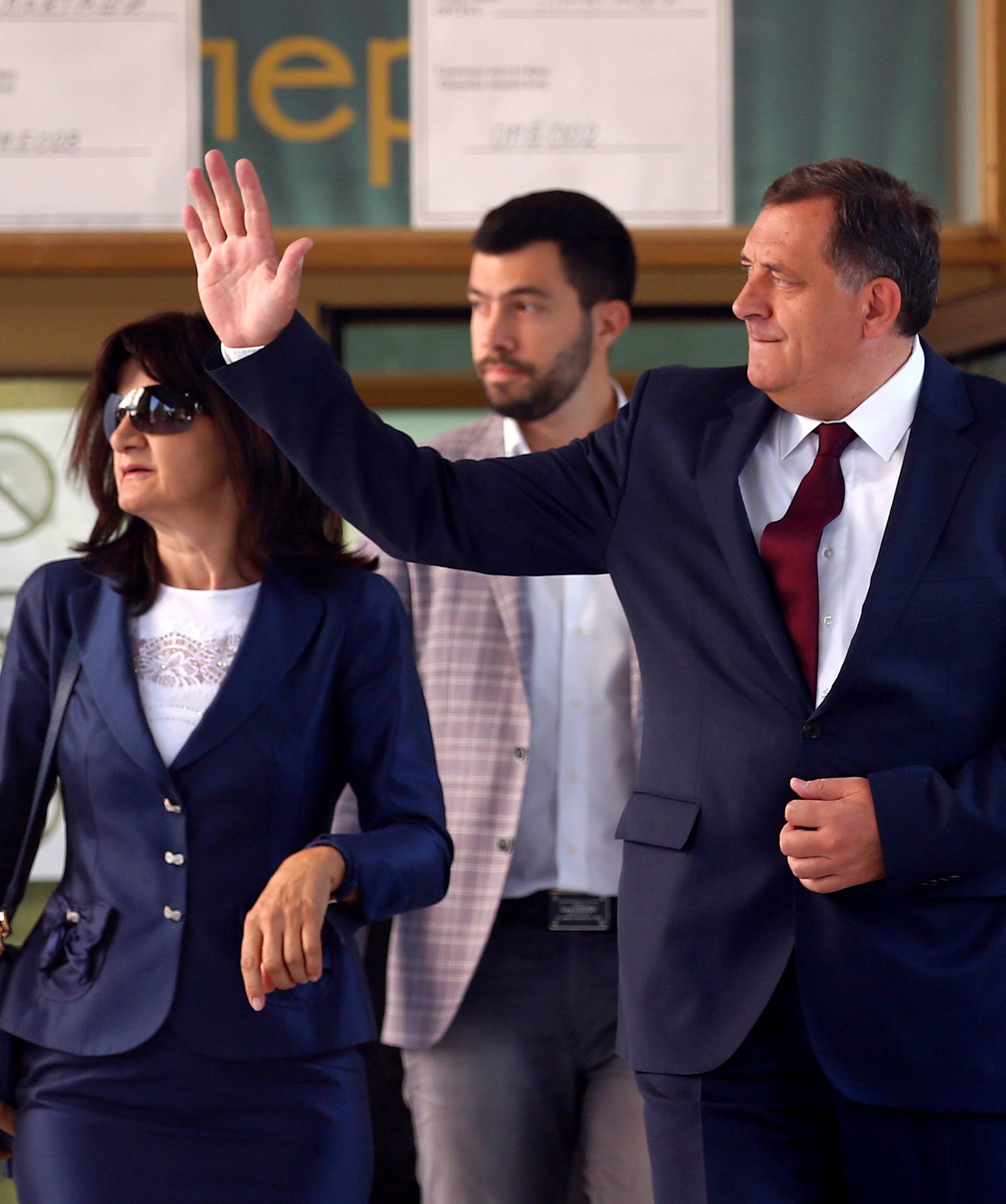 Milorad Dodik, President of Republika Srpska, his wife Snjezana and son Igor leave after voting for a referendum on their Statehood Day in Laktasi near Banja Luka