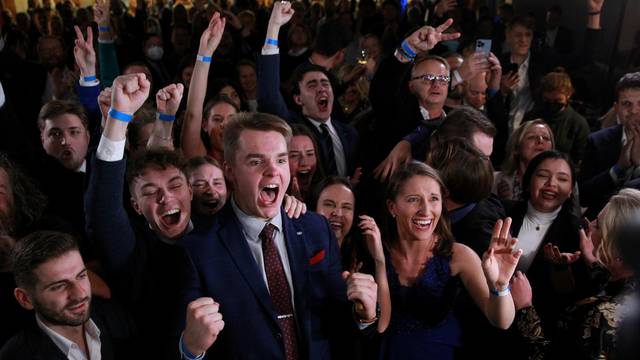 Supporters react to election result at the party's election headquarters, in Prague