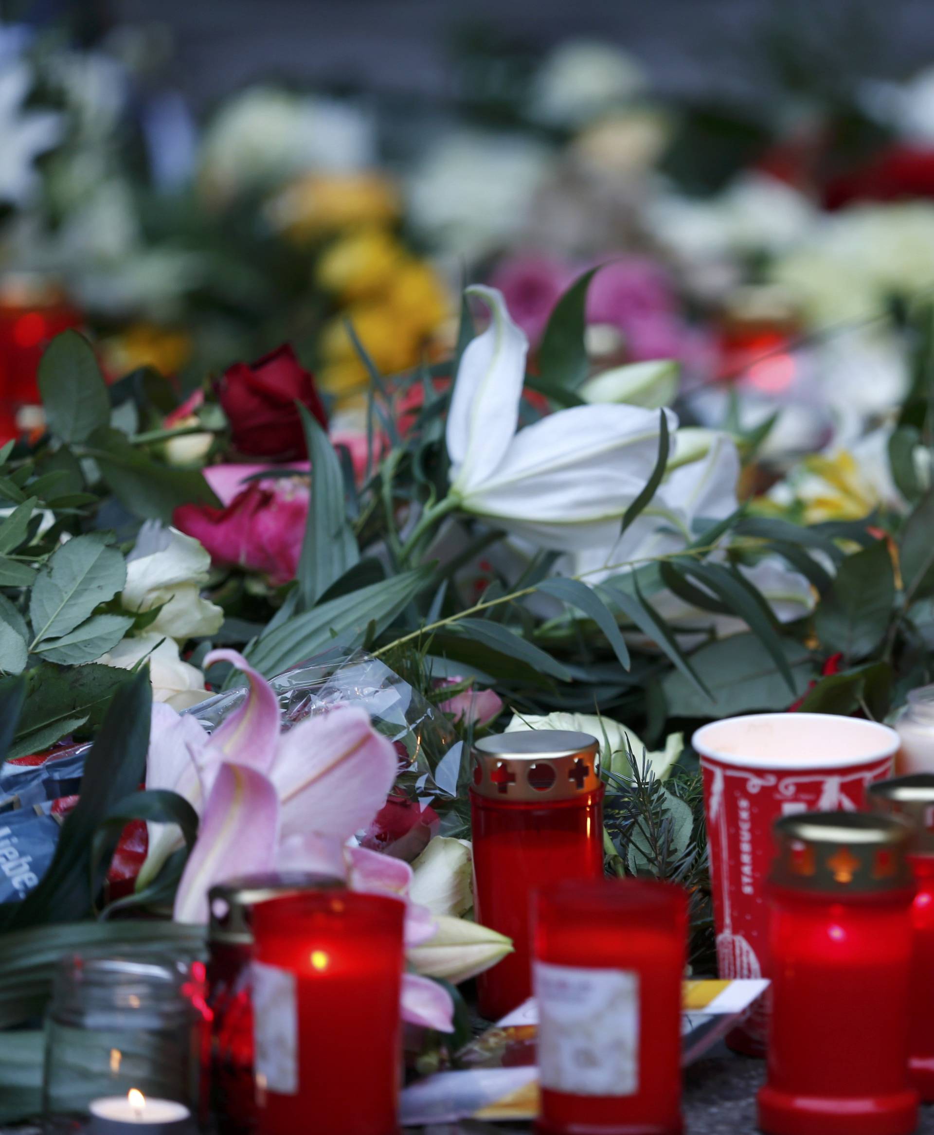 A placard reading "Why?" is placed at the Christmas market in Berlin