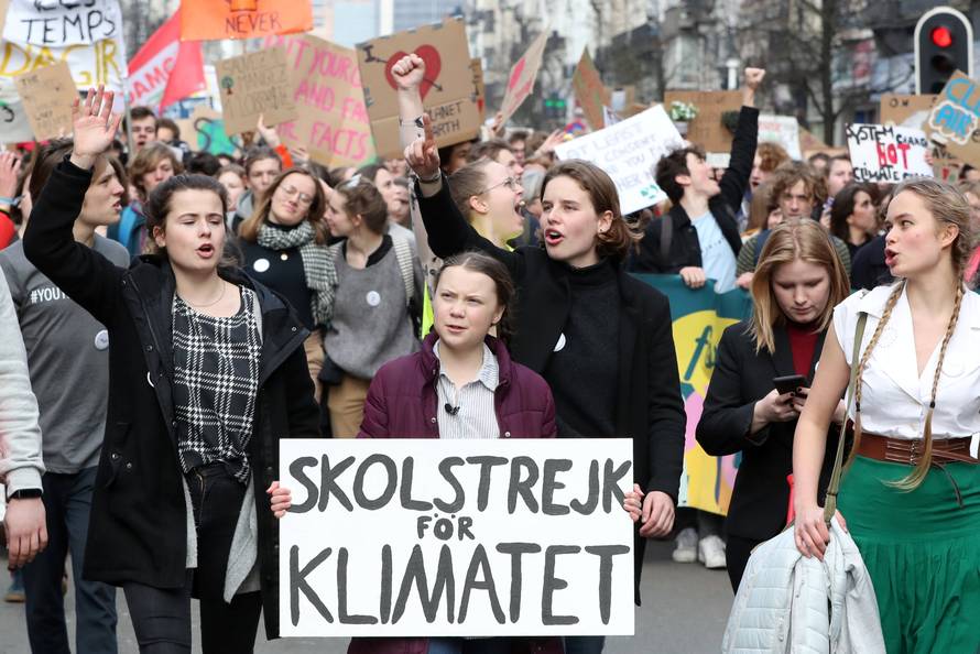 Swedish environmental activist Greta Thunberg and Anuna De Wever, a Belgian climate student activist take part in a protest claiming for urgent measures to combat climate, in central Brussels