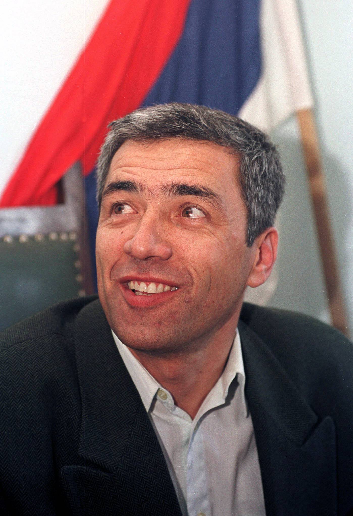 FILE PHOTO - The leader of the Serb community Oliver Ivanovic smiles as he speaks to the press in his office in Mitrovica