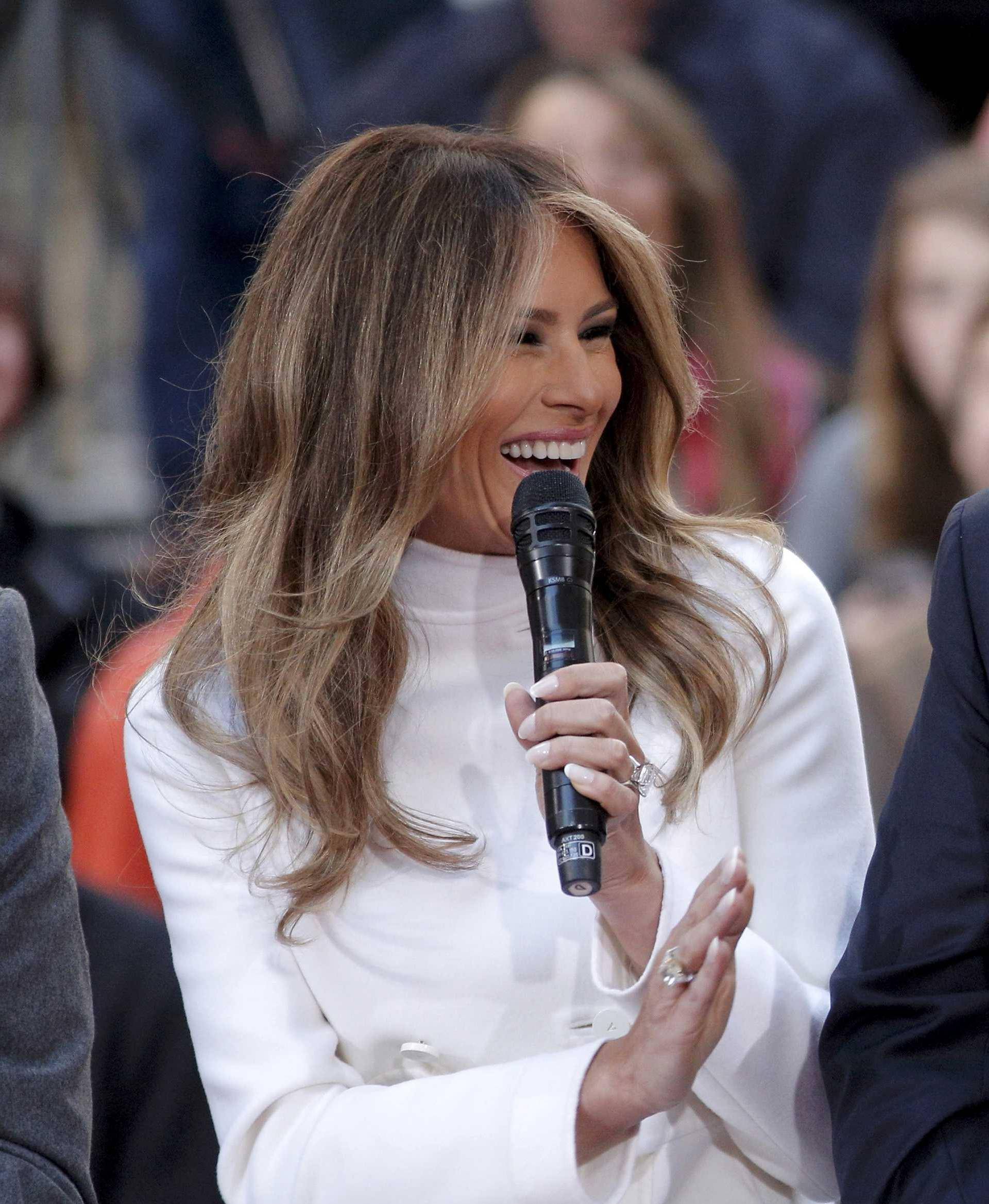 U.S. Republican presidential candidate Donald Trump reacts to an answer his wife Melania gives during an interview on NBC's "Today" show in New York