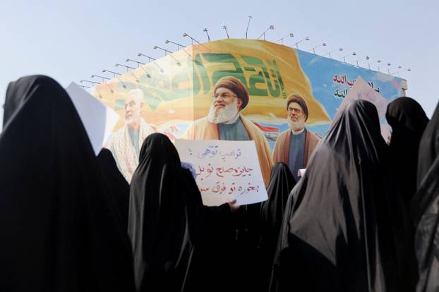 A billboard with picture of late Hezbollah leaders Hassan Nasrallah and Hashem Safieddine, and senior Iranian military commander General Qassem Soleimani is displayed during a rally in support of the people of Gaza, after Friday prayers in Tehran