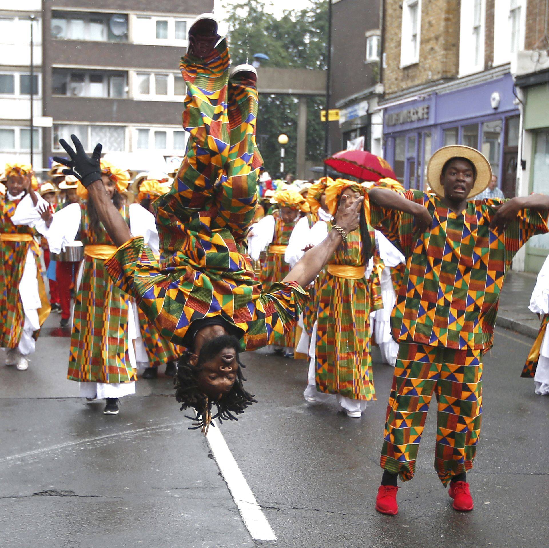 Performers participate in the children's day parade at the Notting Hill Carnival in London