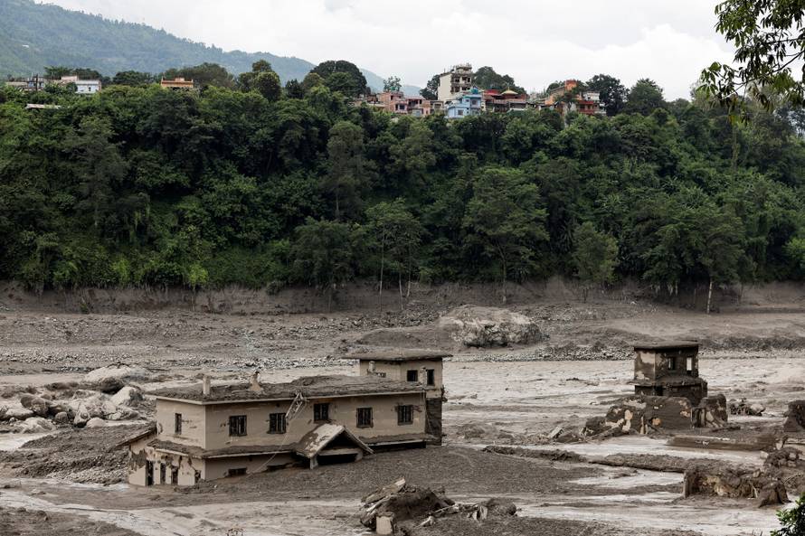 Mud covers buildings following a flash flood at Trishuli, Nepal