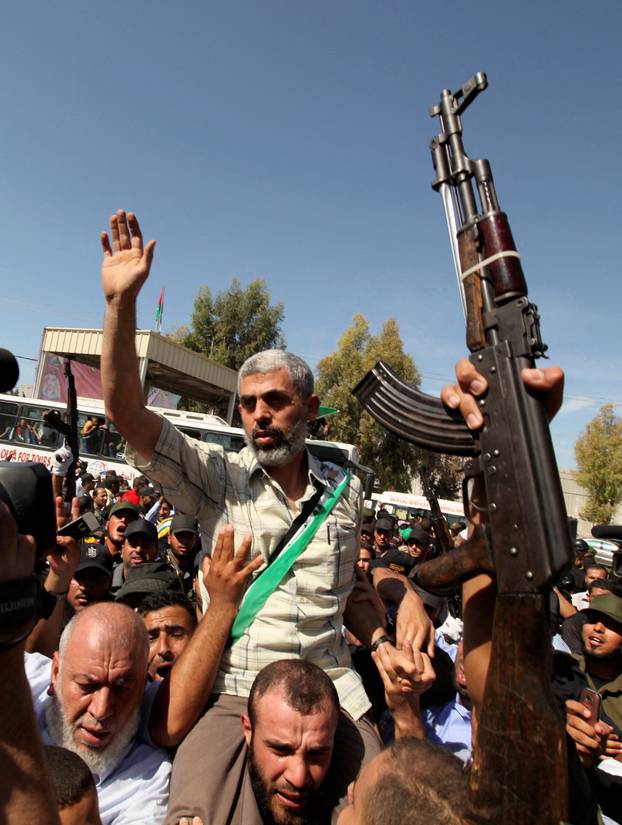 FILE PHOTO: Hamas leader Yahya Sinwar gestures as he arrives with Palestinian prisoners at the Rafah crossing with Egypt in the southern Gaza Strip