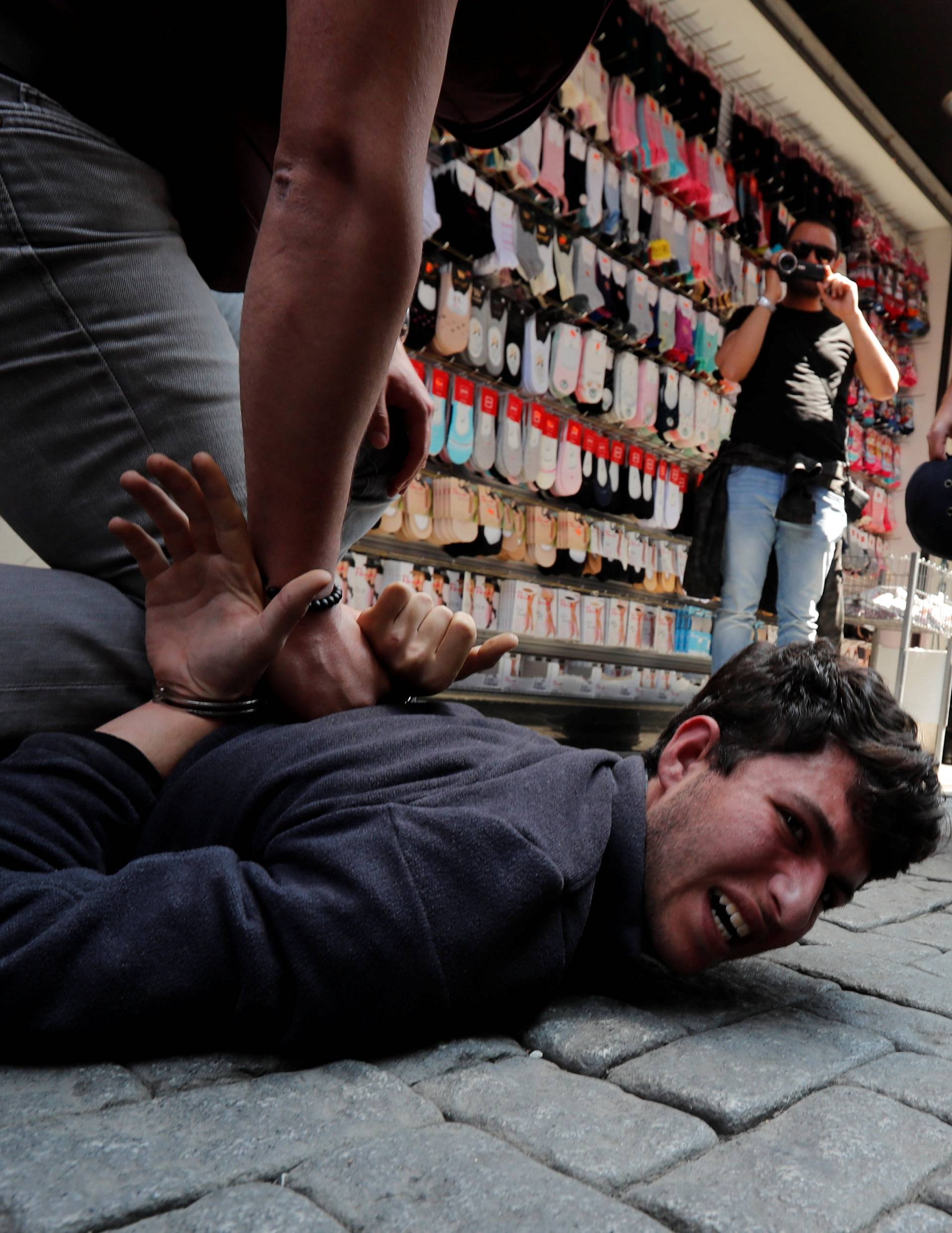 Turkish police detain protesters as they attempted to defy a ban and march on Taksim Square to celebrate May Day in Istanbul