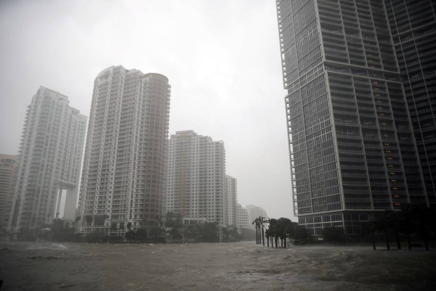 Water rises up to a sidewalk by the Miami river as Hurricane Irma arrives at south Florida, in downtown Miami, Florida, U.S.
