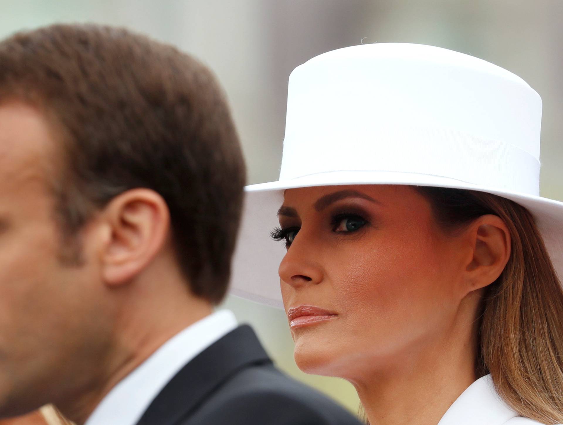 Melania Trump listens as French President Macron speaks at the White House in Washington