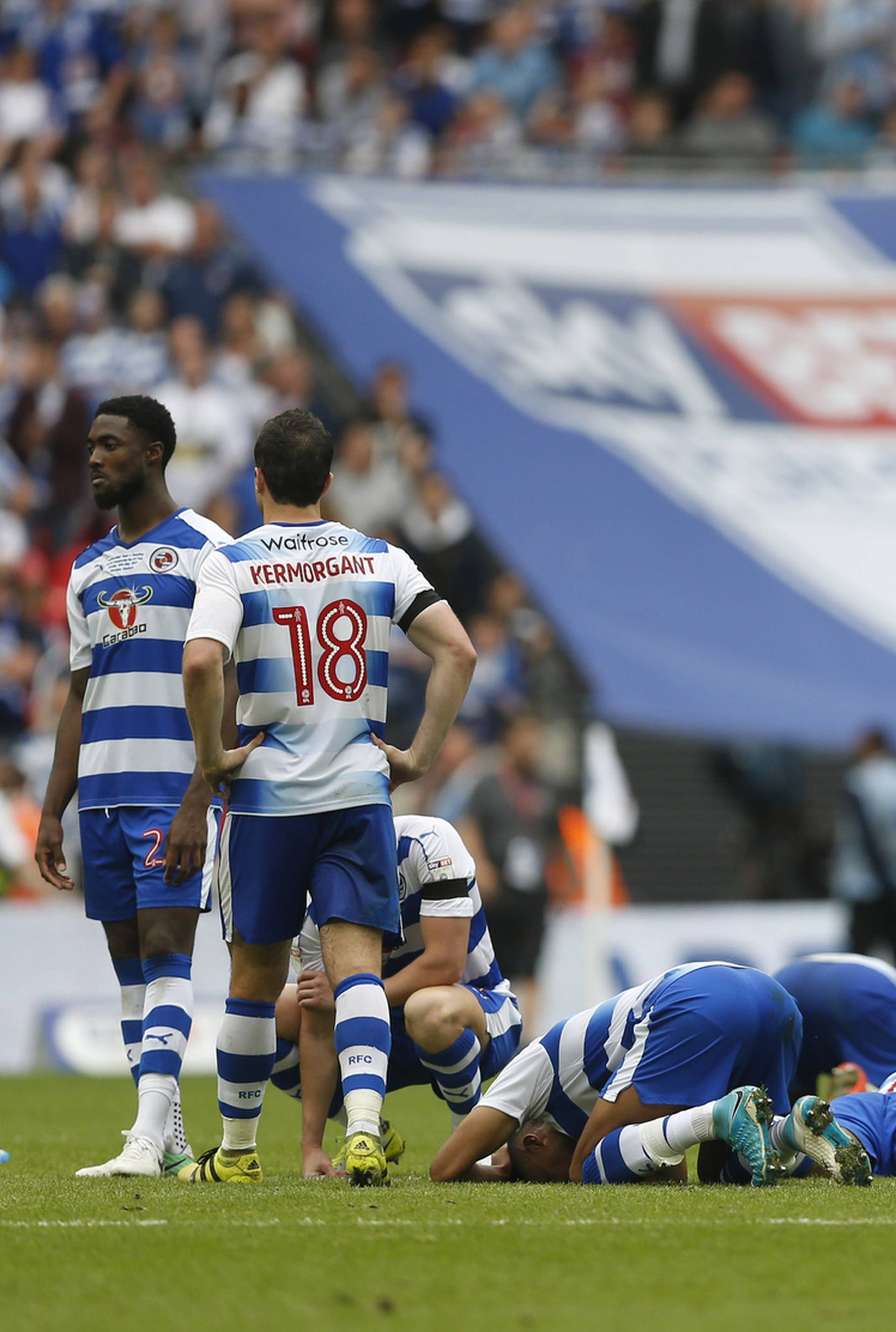 Reading players look dejected after losing the penalty shootout