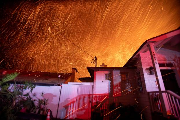 Palisades fire burns during a windstorm on the west side of Los Angeles