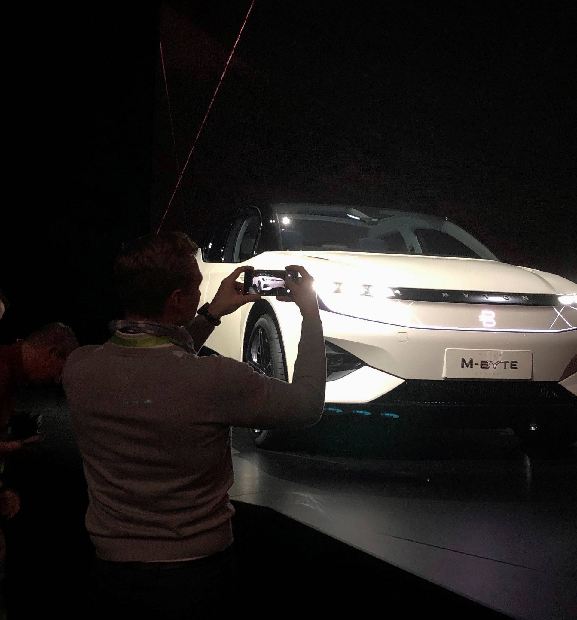 Photographers gather around Byton's electric M-Byte vehicle during the 2019 CES in Las Vegas,