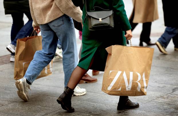 FILE PHOTO: Women carry Zara bags in Bilbao