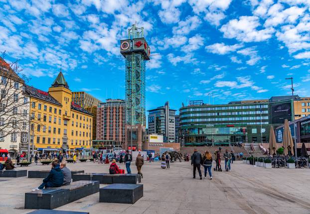 OSLO, NORWAY, APRIL 16, 2019: People are strolling on a square i