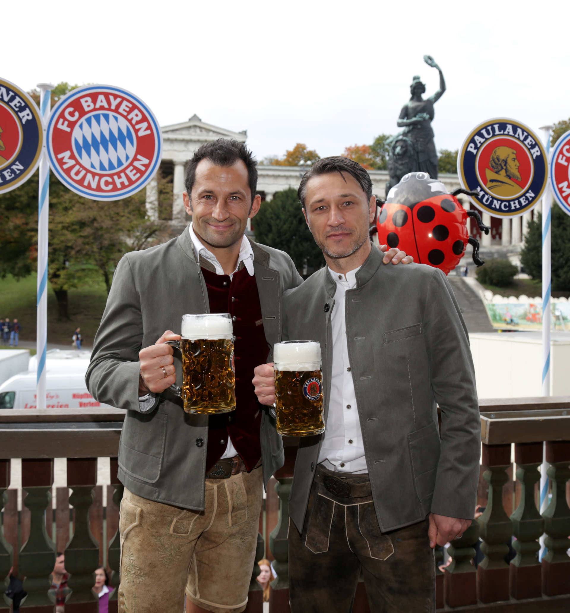 FC Bayern Munich's coach Niko Kovac and sporting director Hasan Salihamidzic pose during a visit at the Oktoberfest in Munich