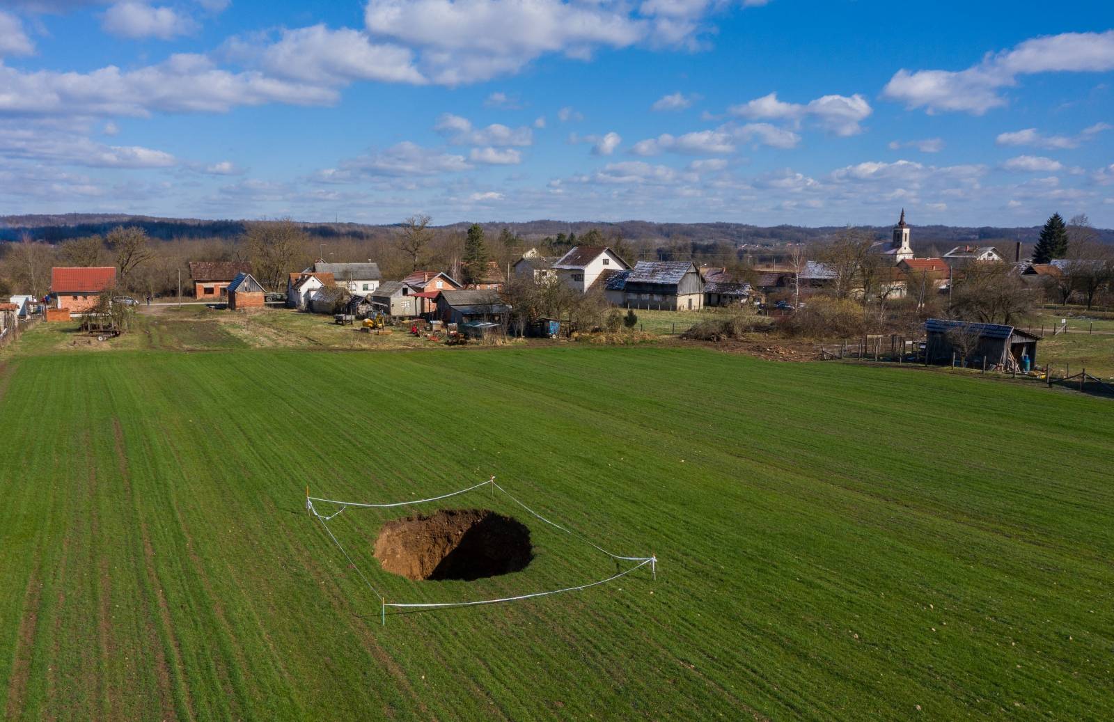 Sinkhole is seen in the field in village Mecencani