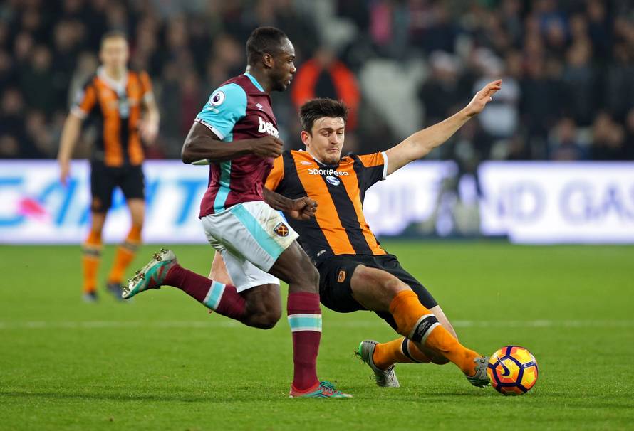 Hull City's Harry Maguire in action with West Ham United's Michail Antonio