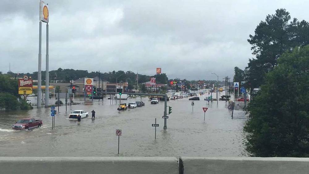 Floodwaters are seen on Range Road and I-12 in Denham Springs, Livingston Parish