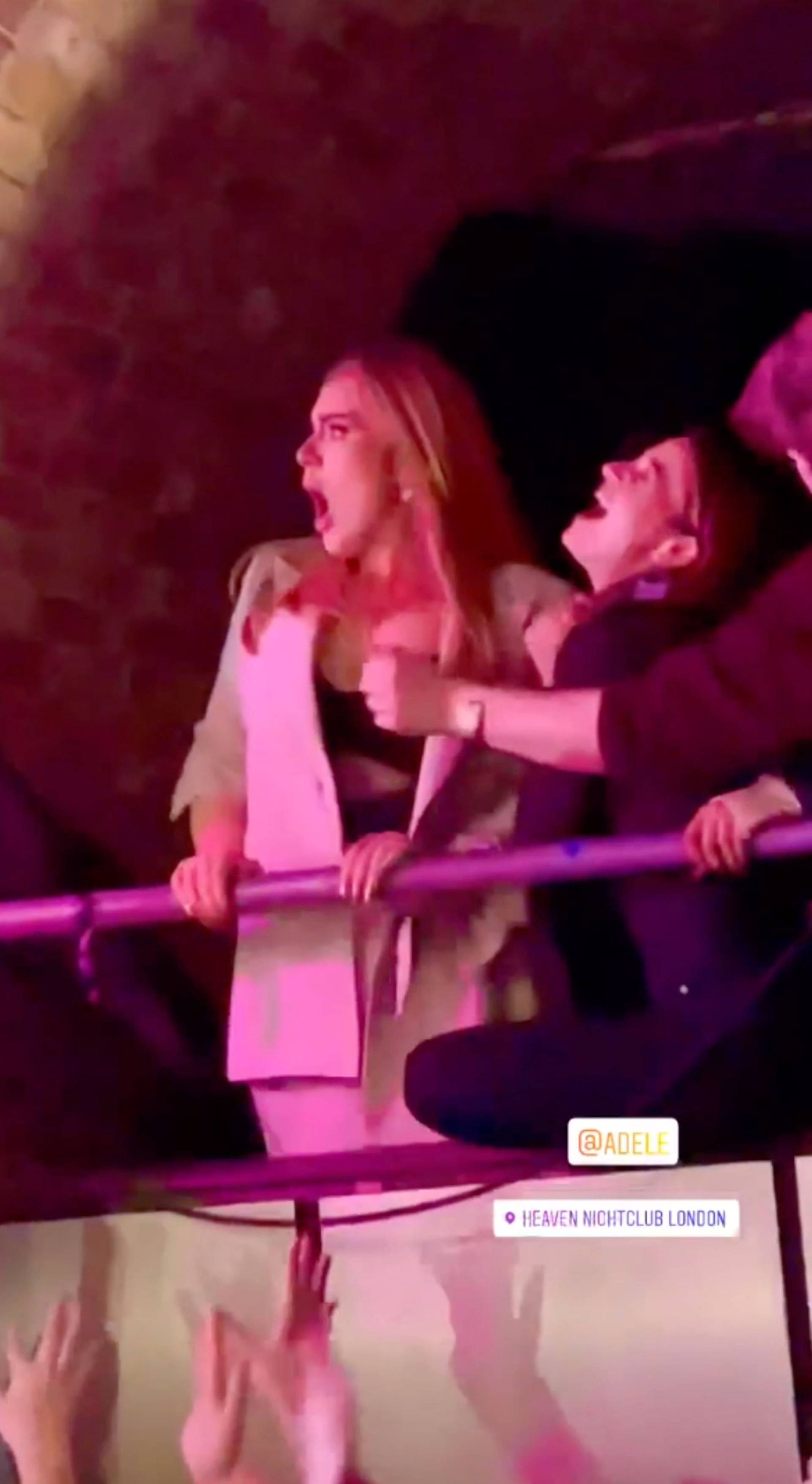 Adele playfully grabs a stripper pole and dances as she enjoys a fun night at Heaven nightclub in London