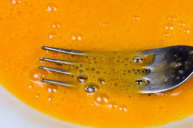 Closeup macro whisked eggs french toast