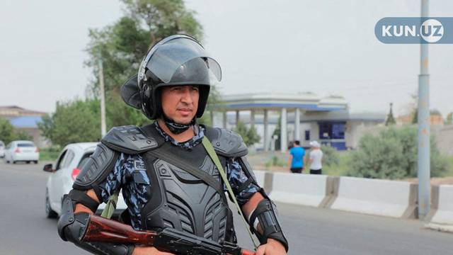 An Uzbek law enforcement officer guards a street in Nukus, capital of the northwestern Karakalpakstan region