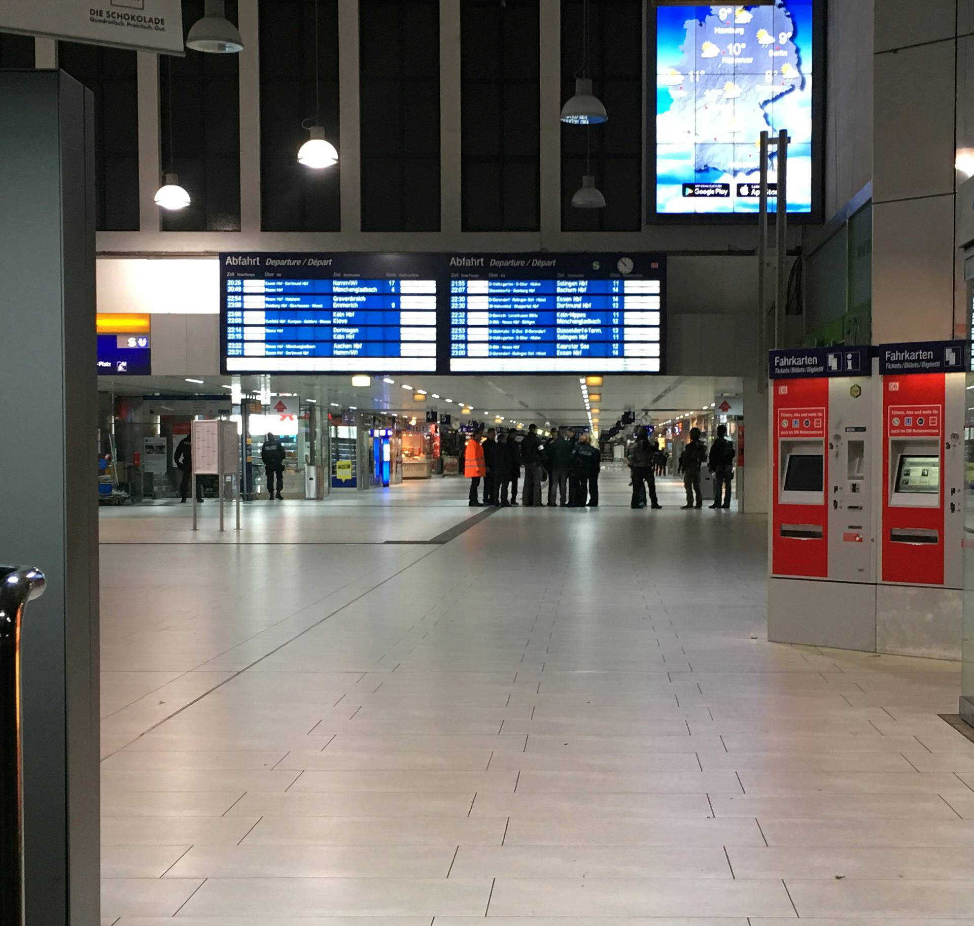 Staff members are pictured inside Dusseldorf train station