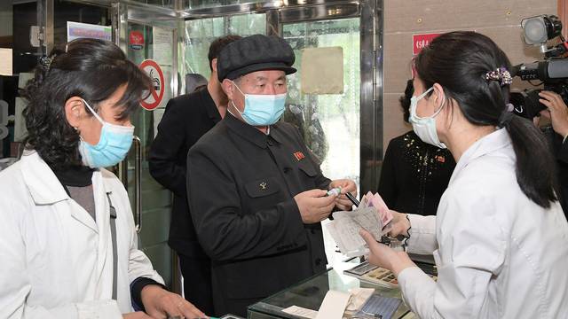 Pak Jong Chon, member of the Presidium of the Political Bureau and secretary of the Central Committee of the Workers' Party of Korea, inspects a pharmacy amid the coronavirus disease (COVID-19) pandemic, in Pyongyang