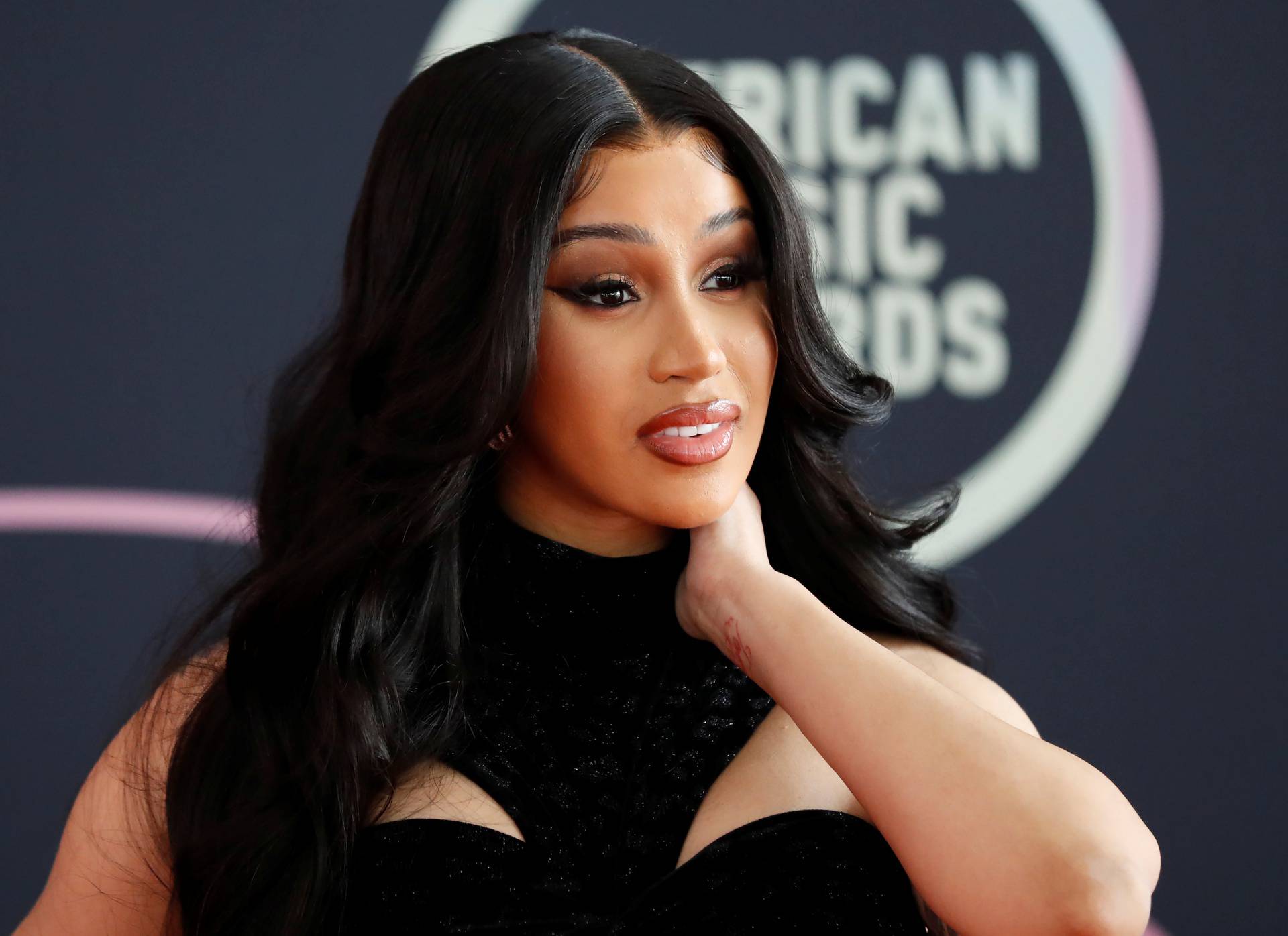 Show host Cardi B poses at a photo op ahead of the 49th Annual American Music Awards in Los Angeles