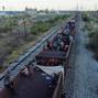 Asylum seekers heading to the U.S. travel on a train, in El Carmen
