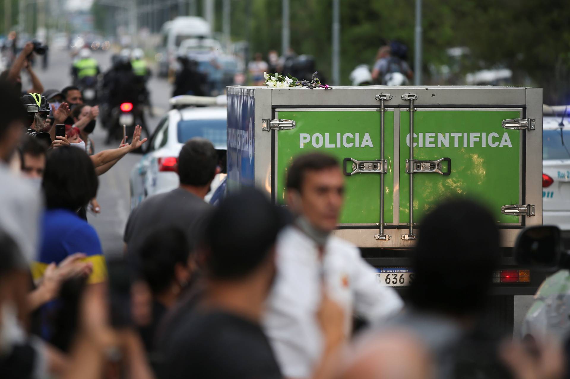 A scientific police vehicle carrying the body of Argentine great Diego Maradona leaves the house where he was staying