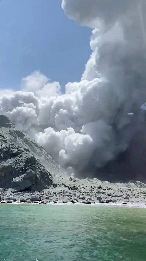 Thick smoke from the volcanic eruption of Whakaari, also known as White Island, is seen in New Zealand