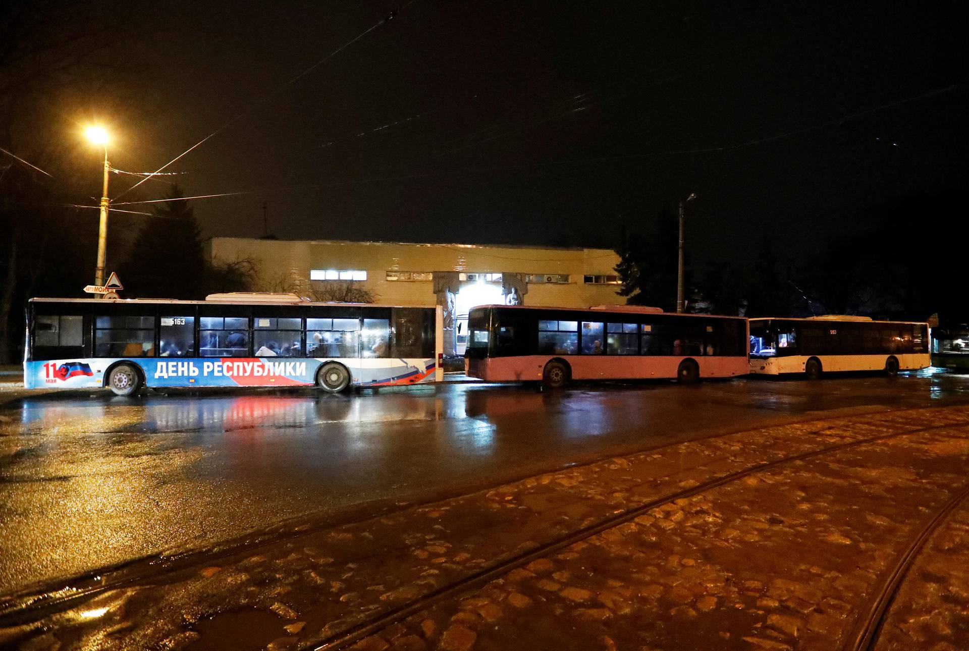 Buses arranged to evacuate local residents are seen in the rebel-controlled city of Donetsk