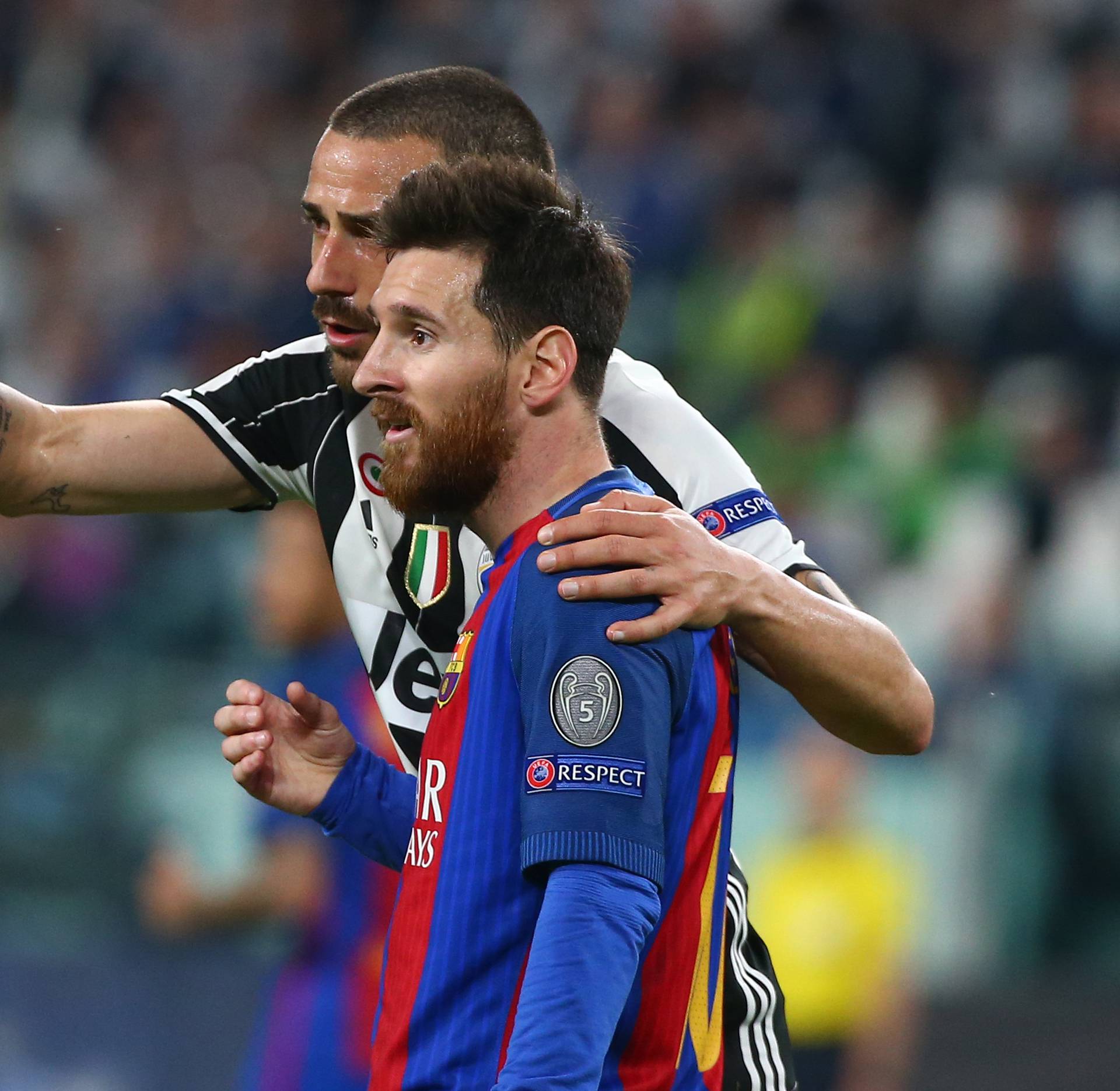 Juventus' Leonardo Bonucci speaks to Barcelona's Lionel Messi